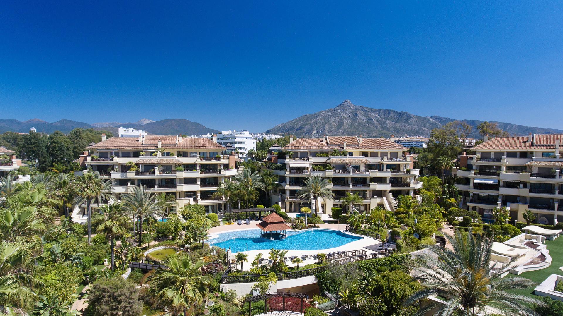 Apartment complex with pool in Marbella with La Concha mountain behind